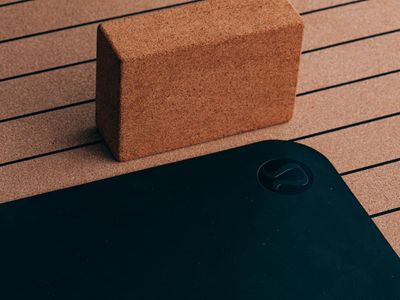 Close up of a yoga mat and blocks.