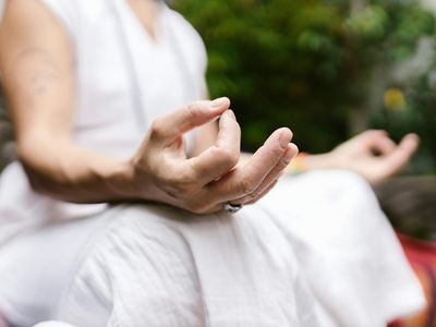 Hands in a mudra position during practice.